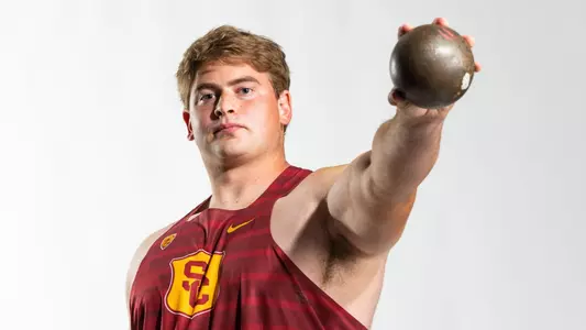 McKay Johnson holding shot put