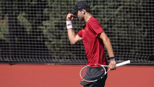Stefan Dostanic fist-pumps after a point won in his match at Mark Stadium