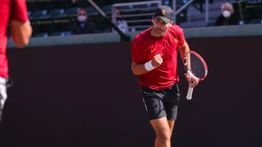 Stefan Dostanic cheers a doubles point won at Marks Stadium