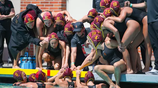 Marko Pintaric and the USC team huddle up during an OT win over Stanford at Uytengsu Aquatics Center