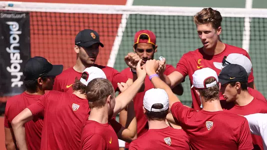 The team huddles up for a cheer before a match vs. Washington at Marks Stadium