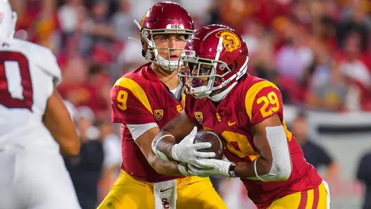 USC Trojans Football quarterback Kedon Slovis hands off to Vavae Malepeai