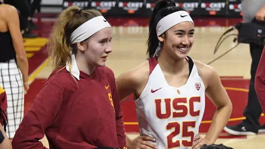 India Otto and Alyson Miura during a timeout at Galen Center