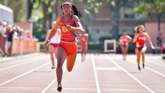 TeeTee Terry running with baton