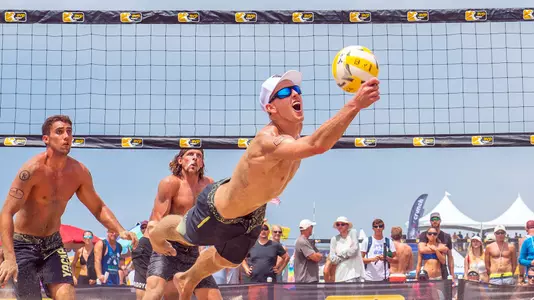 Tri Bourne dives for a ball/Jim Wolf photography