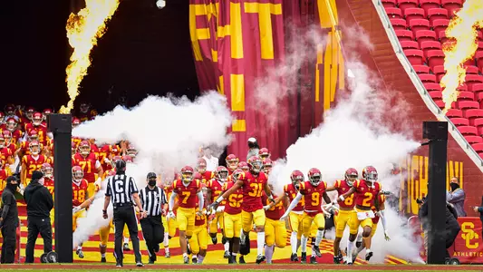 USC Trojans Football team runs out of tunnel at United Airlines Field at L.A. Memorial Coliseum