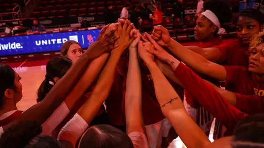 Team huddle at Galen Center