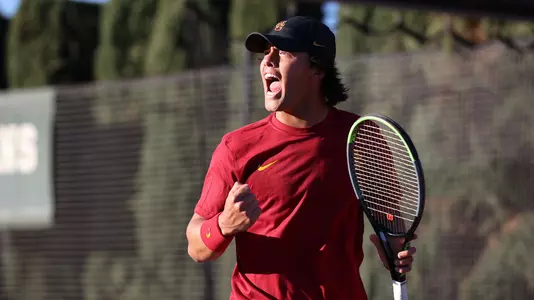 Bradley Frye cheers a point won in his match vs. UC Irvine at Marks Stadium