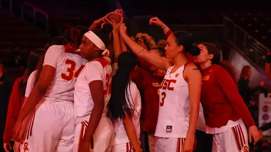 Team huddle at Galen Center