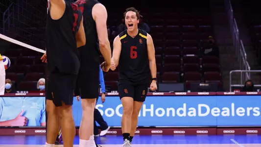 Chris Hall cheers after winning a point