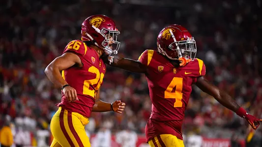 USC Trojans Football running back Travis Dye and wide receiver Mario Williams celebrate