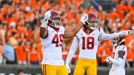 USC Trojans Football defensive lineman Tuli Tuipulotu and inside linebacker Eric Gentry