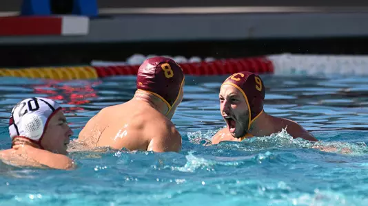 Jake Ehrhardt and Marcus Longton cheer a big goal scored in USC's  win over Stanford at Uytengsu Aquatics Center
