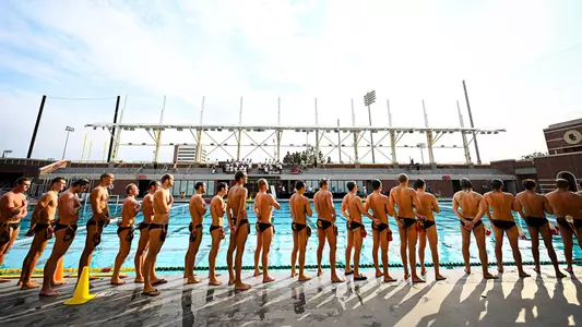 USC team lines up before introductions at Uytengsu Aquatics Center