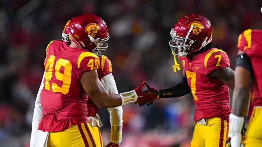 USC Trojans Football Tuli Tuipulotu and Calen Bullock celebrate