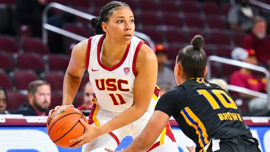 Destiny Littleton looks to pass in a game at Galen Center.