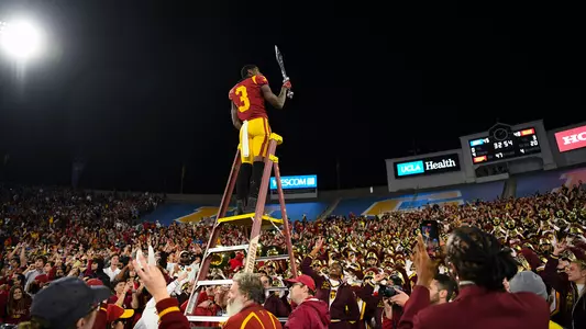 USC Trojans Football wide receiver Jordan Addison leads marching band