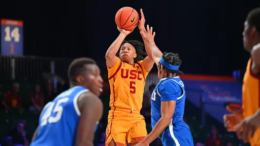 USC Trojans Basketball guard Boogie Ellis shoots over BYU Cougars