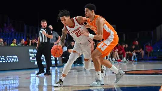 USC Trojans Basketball guard Tre White dribbles against Tennessee Volunteers