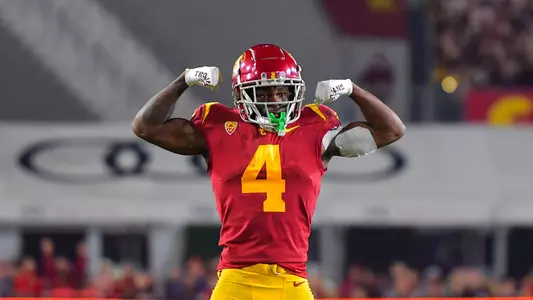 USC Trojans Football wide receiver Mario Williams flexes