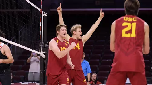 Liam and Simon cheer after winning a point