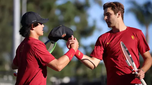 Bradley Frye Stefan Dostanic give each other five during a doubles match at Marks Stadium