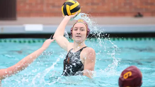 Paige Hauschild rises up with the ball in a game at Uytengsu Aquatics Center.