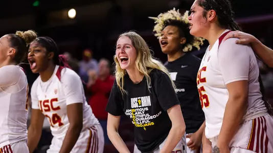 India Otto cheers on her teammates from the bench at Galen Center