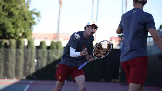 Ryder Jackson cheers during his doubles match vs. UCLA