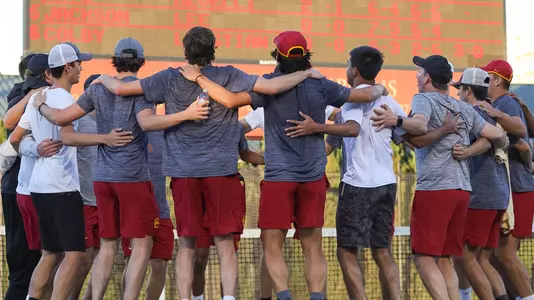 USC players gather up to celebrate a win ver UCLA at Marks Stadium.