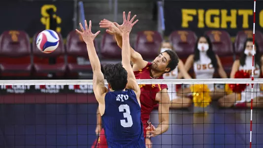 Sam Kobrine swings wrist away for a kill