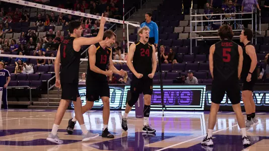 Gallas, Frassrand and Browning celebrate after winning a point.