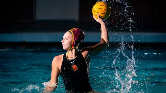 Grace Tehaney rises up with the ball during a photo shoot at Uytengsu Aquatics Center