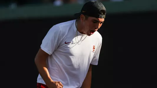 Ryan Colby cheers a point won in his match vs. Stanford at Marks Stadium