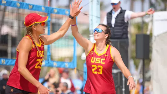 Delaynie Maple and Julia Scoles high five