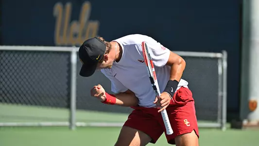 Stefan Dostanic cheers a point won during USC's win at UCLA
