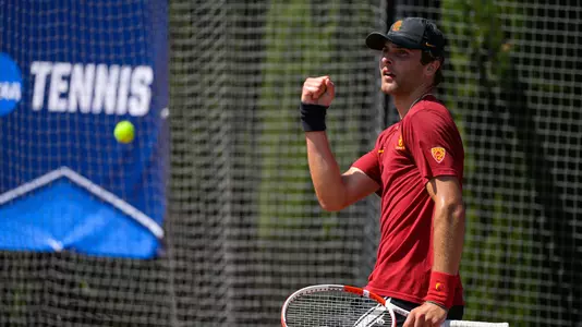Stefan Dostanic cheers during his match in the NCAA Team Second Round at Marks Stadium