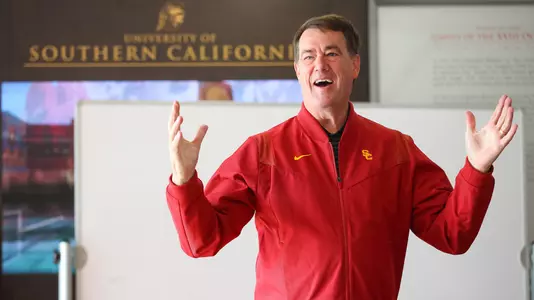 Mike Bohn addresses the swim team at Uytengsu Aquatics Center