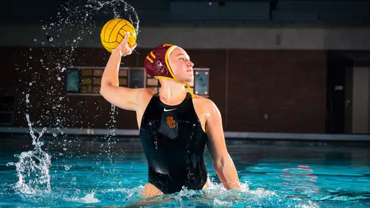 Tilly Kearns rises out of the water with the ball during a photo shoot at Uytengsu Aquatics Center