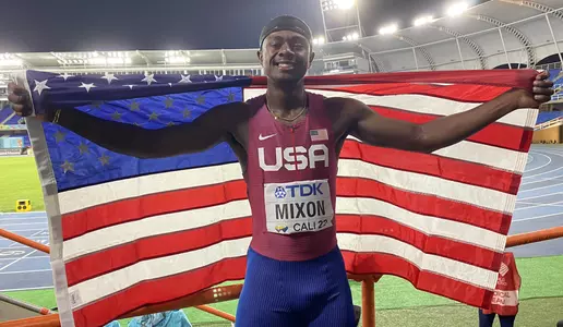 Malik Mixon holding up American flag
