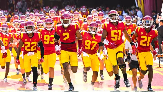 USC Trojans Football team runs out of tunnel at United Airlines Field at L.A. Memorial Coliseum