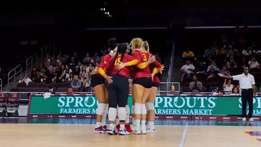 Team huddle at Galen Center