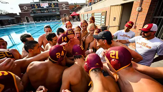 UCS team and players huddle up before a game at Uytengsu Aquatics Center