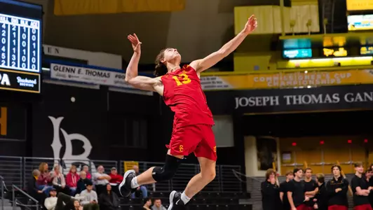 Nate Tennant serves the ball
