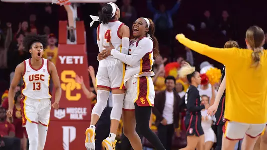 USC players celebrate a 55-46 upset of No. 2 Stanford at Galen Center.