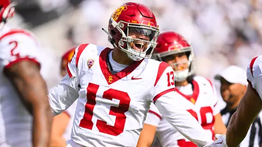 Caleb Williams high fives his teammate