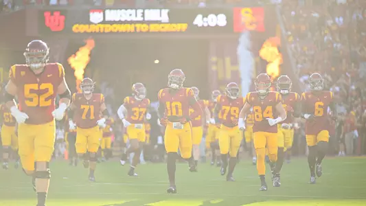 USC Trojans Football team runs out of Coliseum tunnel