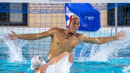 Goalie Bernardo Herzer stretches for a stop in a game at Uytengsu Aquatics Center