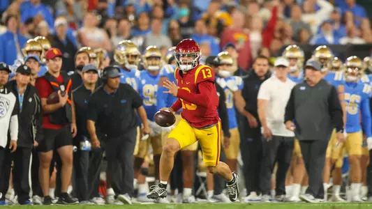 USC Trojans Football quarterback Caleb Williams runs against UCLA Bruins
