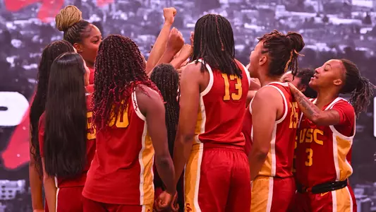 USC players huddle up during a photo shoot
